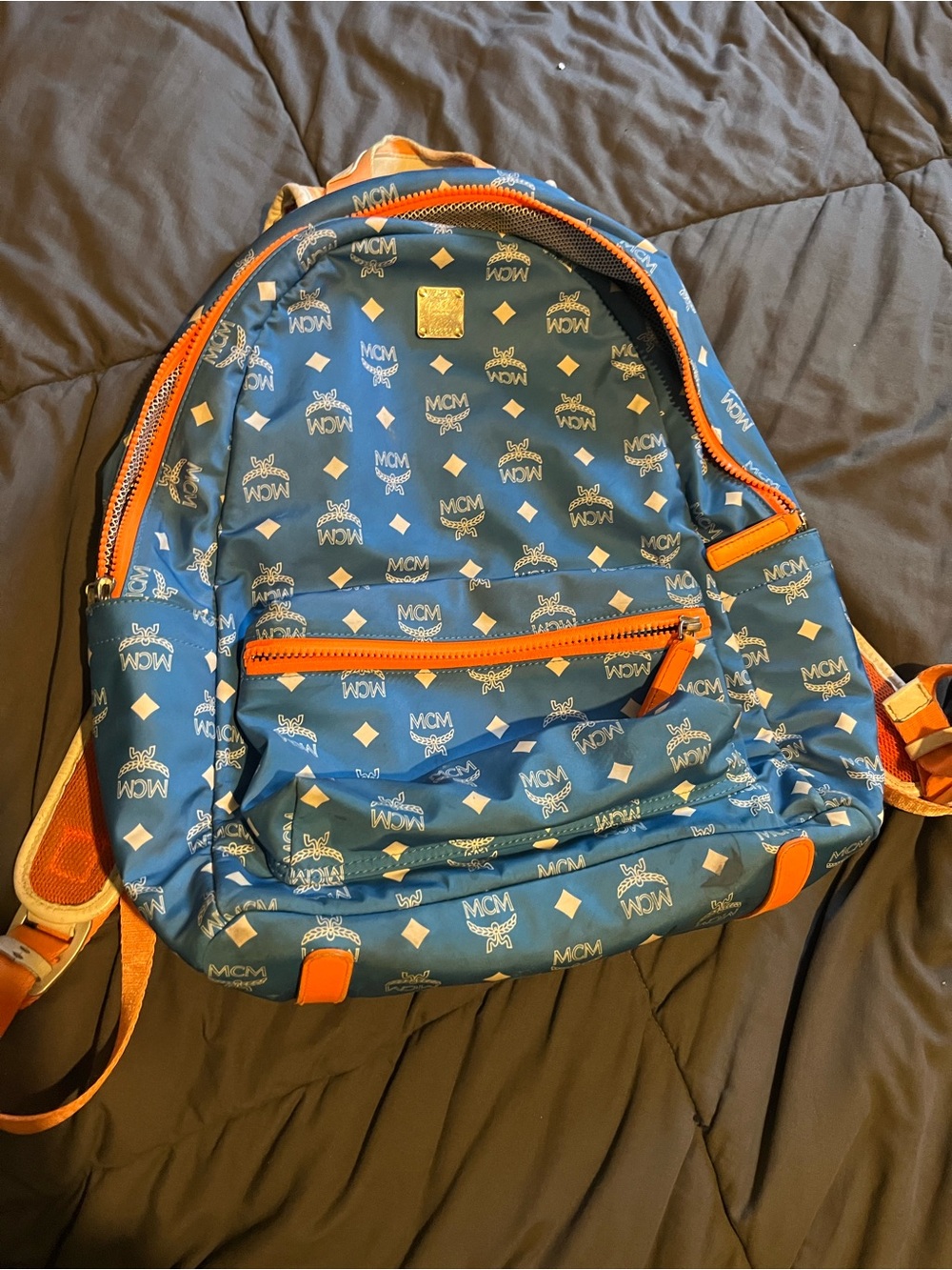 MCM Blue Backpack with Orange Trim and Logo Print